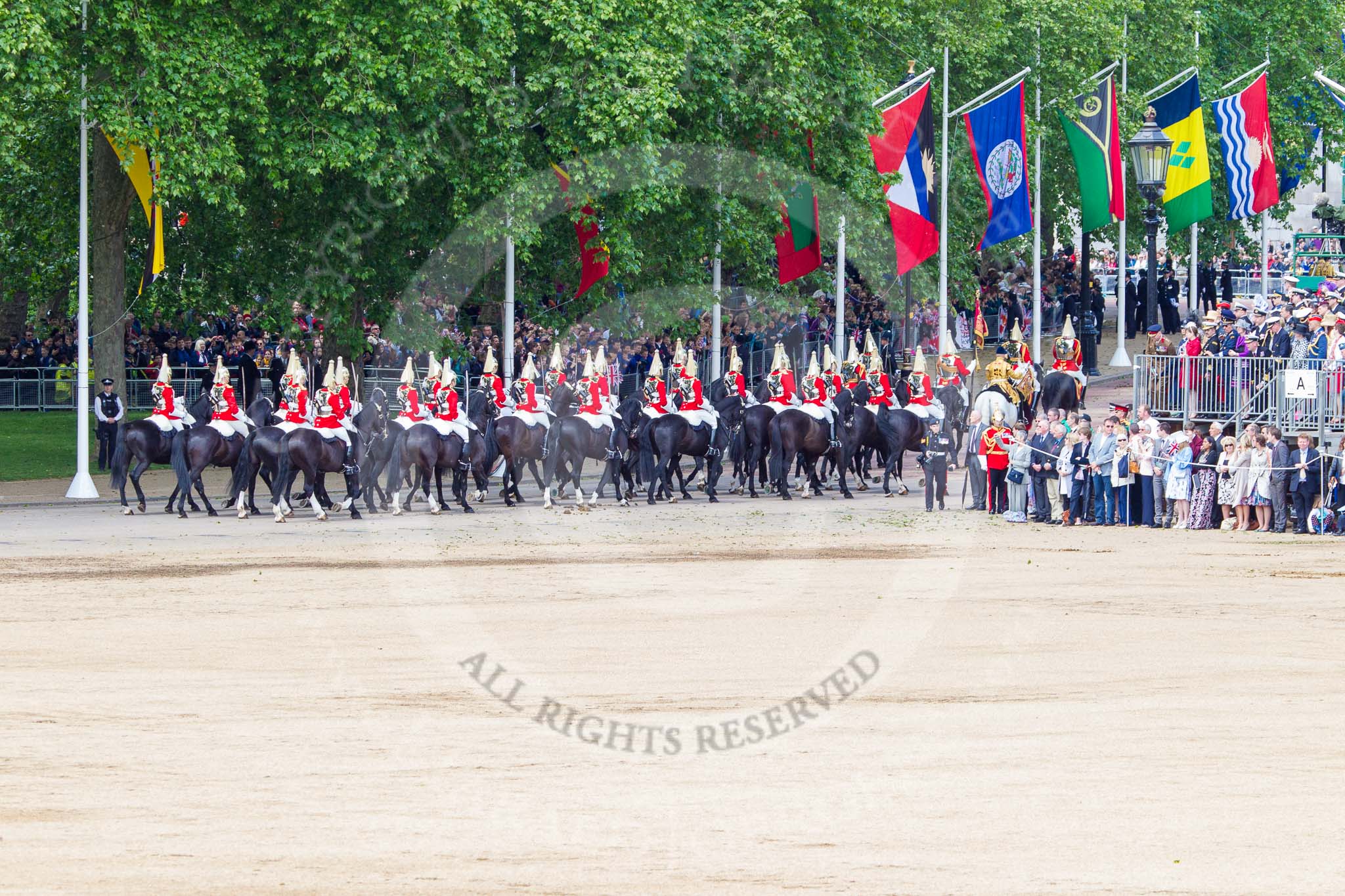 Trooping the Colour 2013: The Household Cavalry is marching off, led by the Field Officer of the Escort, Major Nick Stewart, The Life Guards, followed by the Trumpeter, Standard Bearer, Standard Coverer. and The Life Guards as first and second divisions of the Sovereign's Escort. Image #783, 15 June 2013 12:06 Horse Guards Parade, London, UK