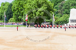 Trooping the Colour 2013: A wide angle view of Horse Guards Parade - the Band of the Grenadier Guards is marching along St. James's Park, with the Guards Memorial on the right, and the lake, and lots of spectators, on the left. Image #93, 15 June 2013 10:28 Horse Guards Parade, London, UK