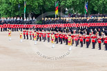 Trooping the Colour 2013: The five Drum Majors leading the Massed Bands during the Massed Bands Troop. Behind the line of guardsmen, with the red plumes, the Household Cavalry (The Blues and Royals) and next to them the Mounted Bands of the Household Cavalry. Image #411, 15 June 2013 11:13 Horse Guards Parade, London, UK