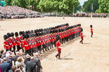 Trooping the Colour 2013: No. 5 Guard, F Company Scots Guards, during the March Past. In front, swords drawn, Major J A Hughes, Second Lieutenant P M Prys-Roberts, and Captain P W Foster. Image #550, 15 June 2013 11:37 Horse Guards Parade, London, UK