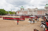 Trooping the Colour 2013: A wide angle overview of Horse Guards Parade during the March Past, with the Royal Colonels on both sides of the dais where HRH The Duke of Kent and HM The Queen are watching the March Past. Image #555, 15 June 2013 11:38 Horse Guards Parade, London, UK