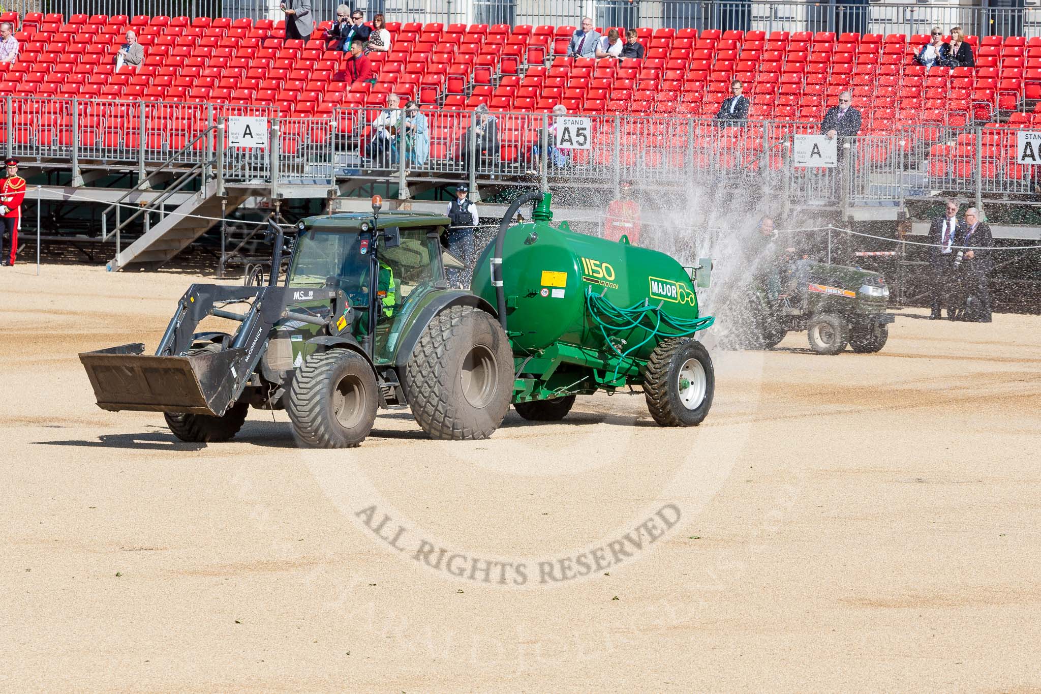 Horse Guards Parade before the event: The dry and dusty ground is watered and levelled in preparation for the parade.