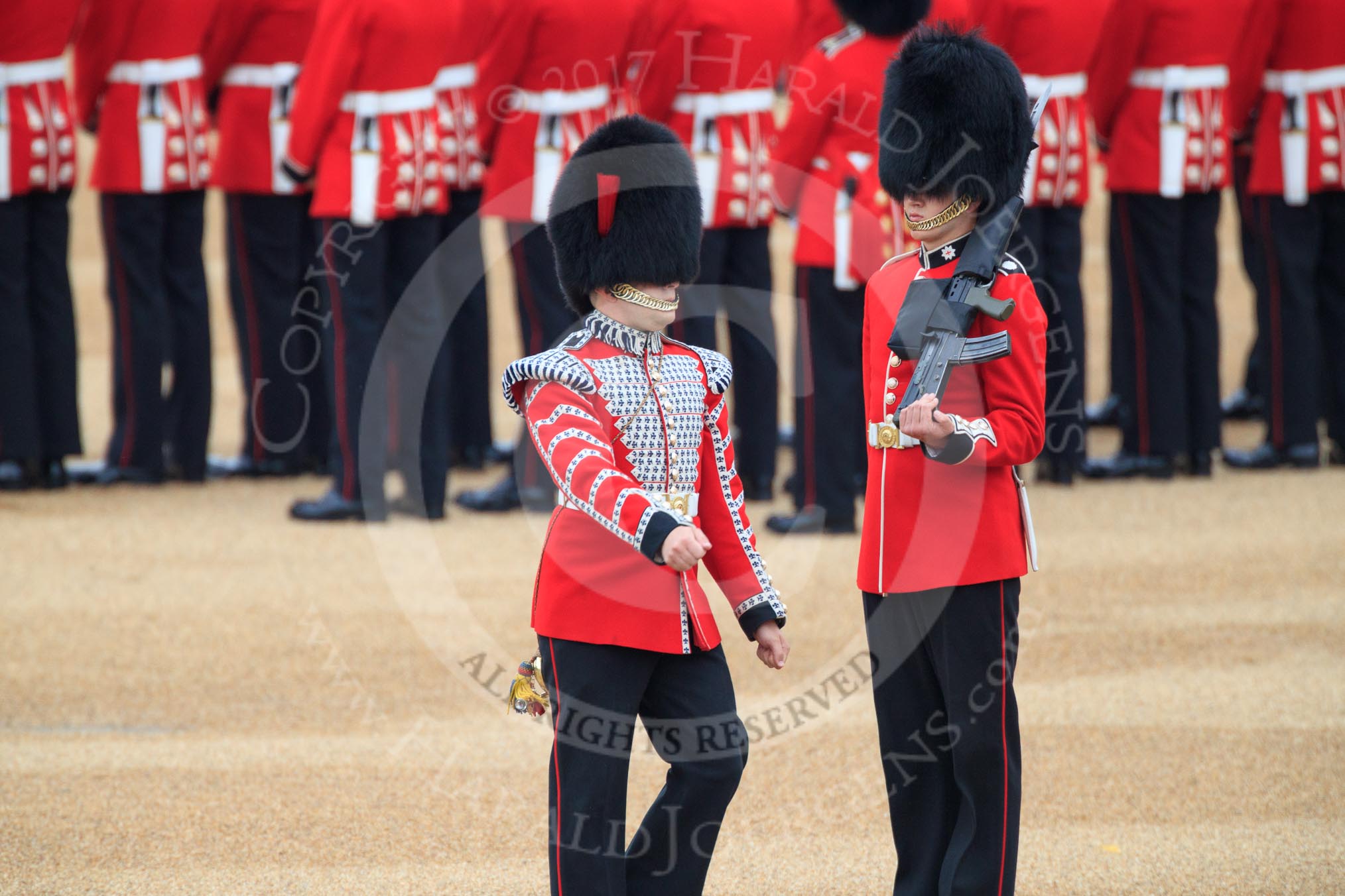 Duty Drummer Sam Orchard, marching around Colour Sentry Guardsman Jonathon Hughes (26), to uncase the Colour during The Colonel's Review 2018 (final rehearsal for Trooping the Colour, The Queen's Birthday Parade)  at Horse Guards Parade, Westminster, London, 2 June 2018, 10:33.
