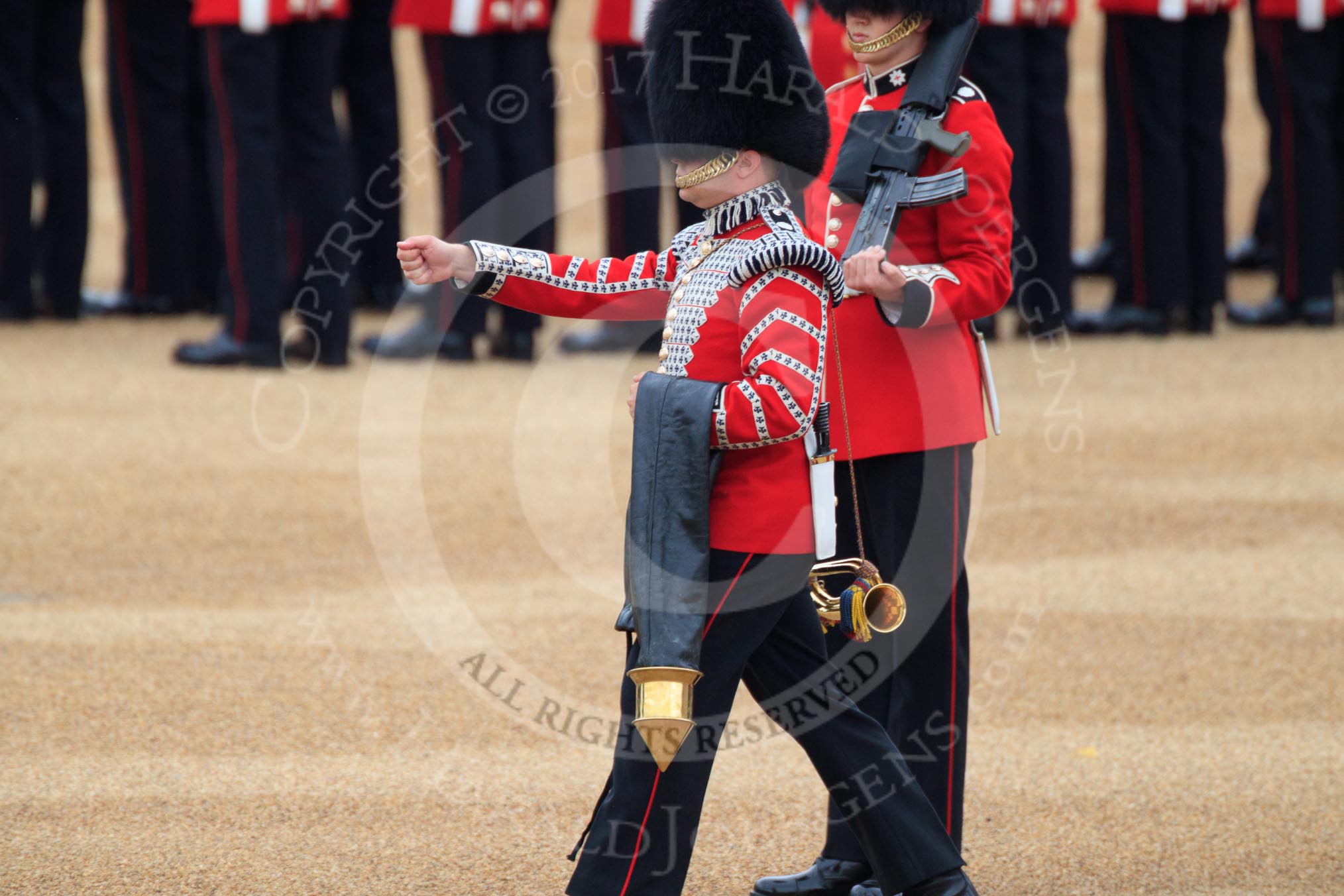 Duty Drummer Sam Orchard marching off with the Colour case, behind him Colour Sentry Guardsman Jonathon Hughes (26), during The Colonel's Review 2018 (final rehearsal for Trooping the Colour, The Queen's Birthday Parade)  at Horse Guards Parade, Westminster, London, 2 June 2018, 10:34.