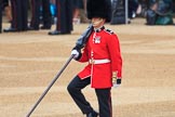 Colour Sergeant Sam McAuley (31) with the still encased colour during The Colonel's Review 2018 (final rehearsal for Trooping the Colour, The Queen's Birthday Parade)  at Horse Guards Parade, Westminster, London, 2 June 2018, 10:32.