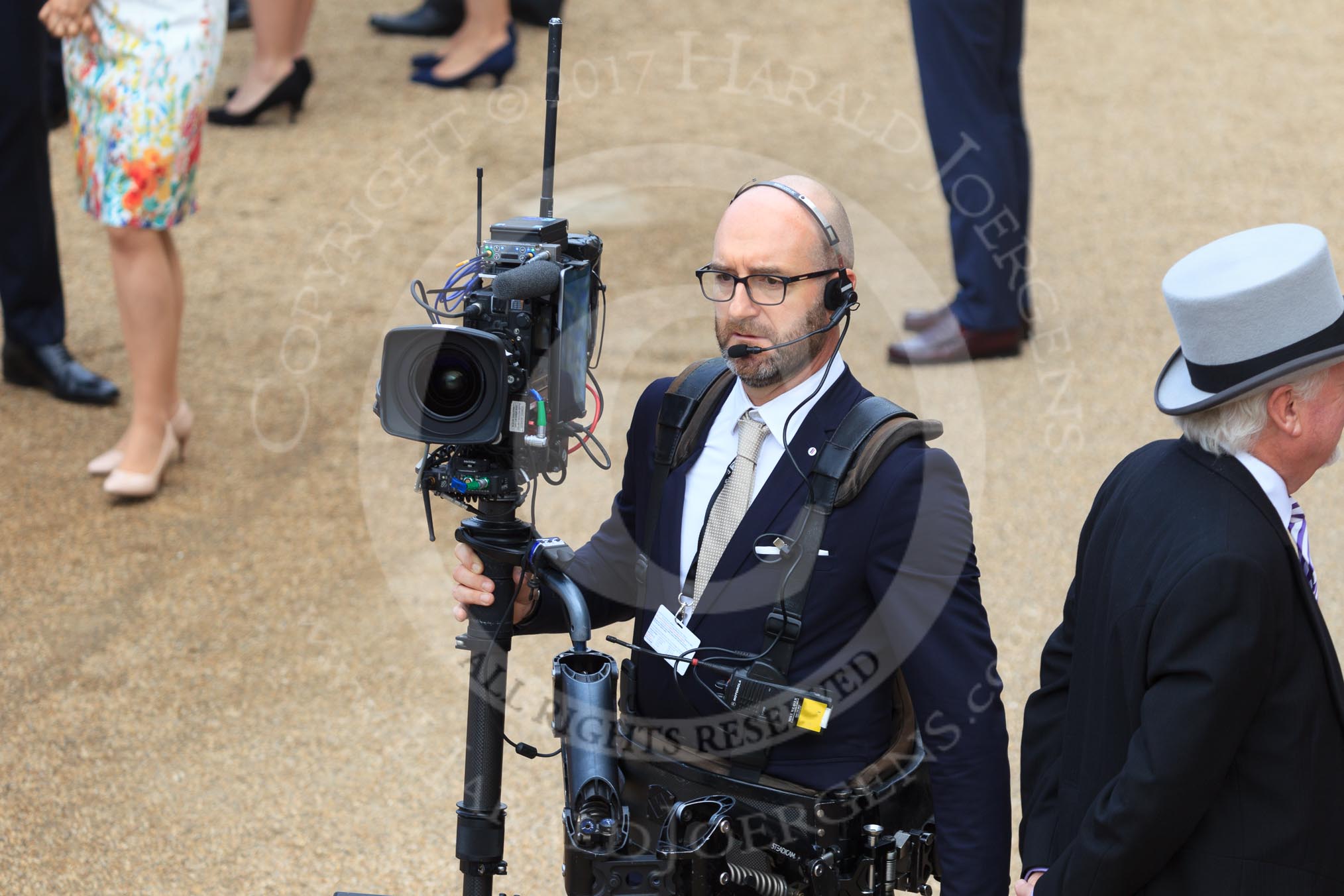 BBC Steadycam operator before during Trooping the Colour 2018, The Queen's Birthday Parade at Horse Guards Parade, Westminster, London, 9 June 2018, 09:36.