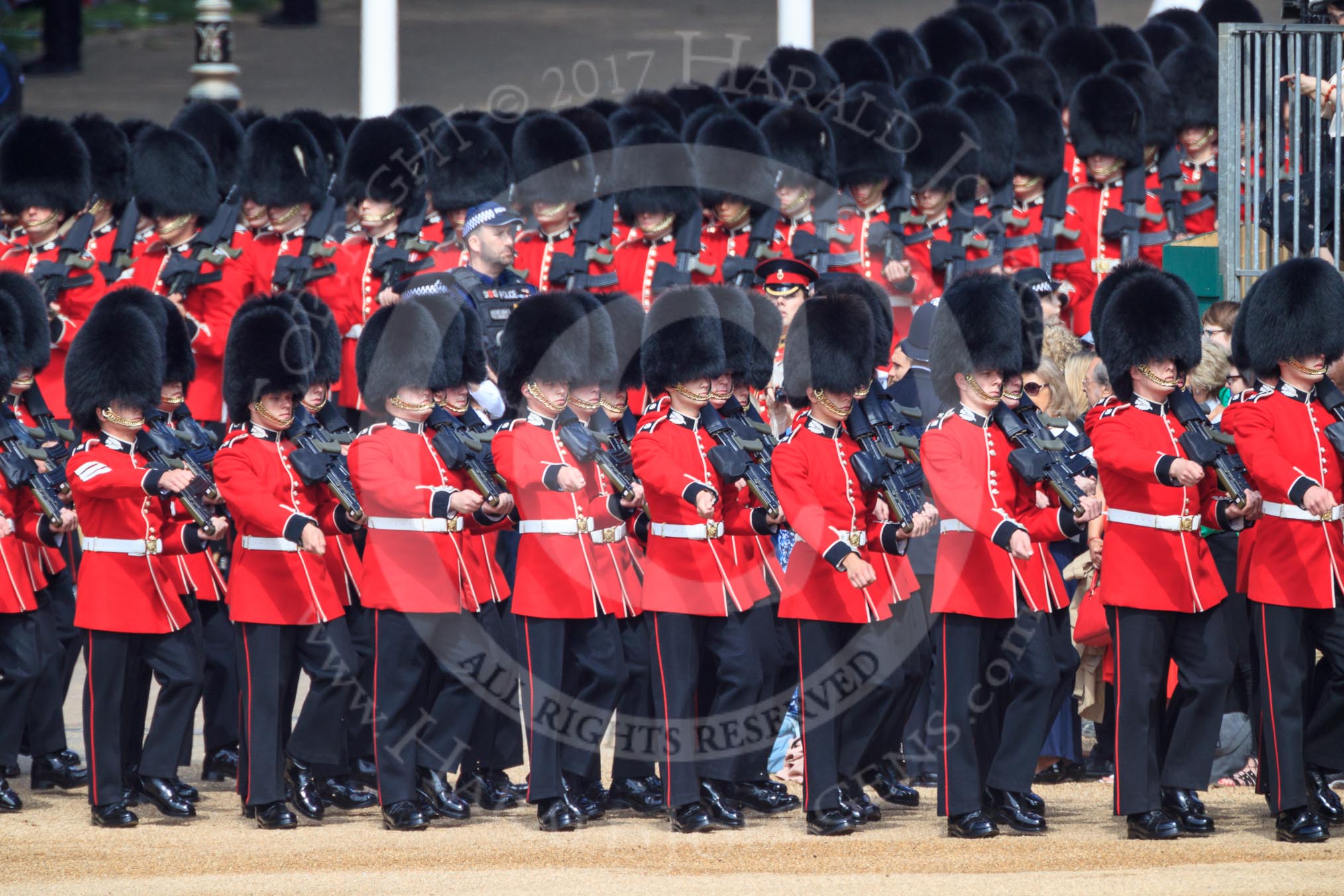 Number Six Guard, F Company, Scots Guards arrives first on Horse Guards Parade during Trooping the Colour 2018 followed bt Number Five Guard, Nijmegen Company, Grenadier Guards, during  The Queen's Birthday Parade at Horse Guards Parade, Westminster, London, 9 June 2018, 10:25.