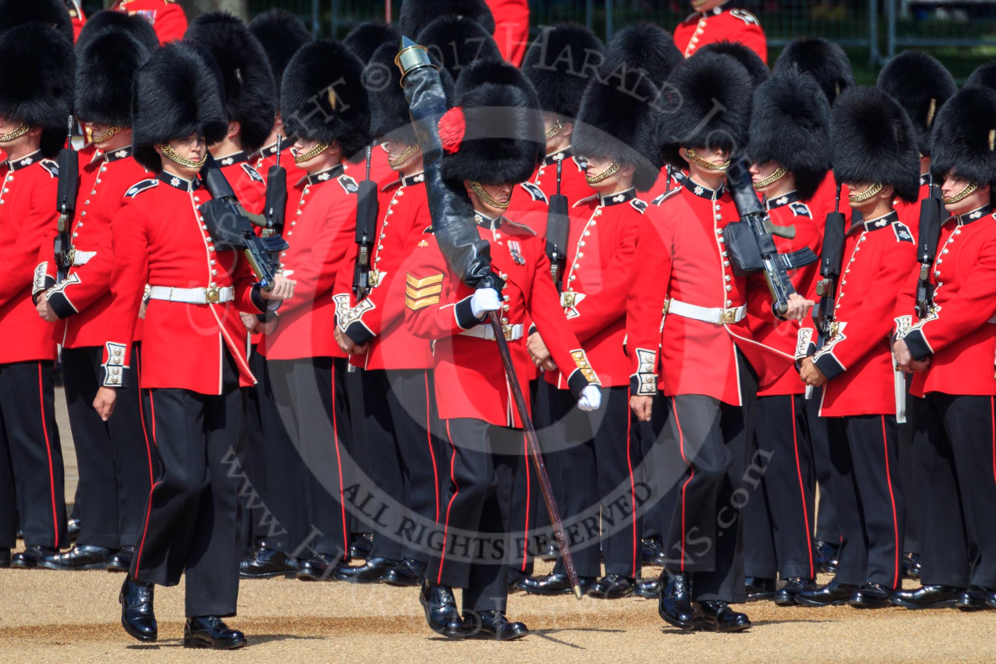 The Colour Party, Colour Sentry Guardsman Jonathon Hughes (26), Colour Sergeant Sam McAuley (31), and Colour Sentry Guardsman Sean Cunningham (21) marching towards their position on Horse Guards Parade during Trooping the Colour 2018, The Queen's Birthday Parade at Horse Guards Parade, Westminster, London, 9 June 2018, 10:31.